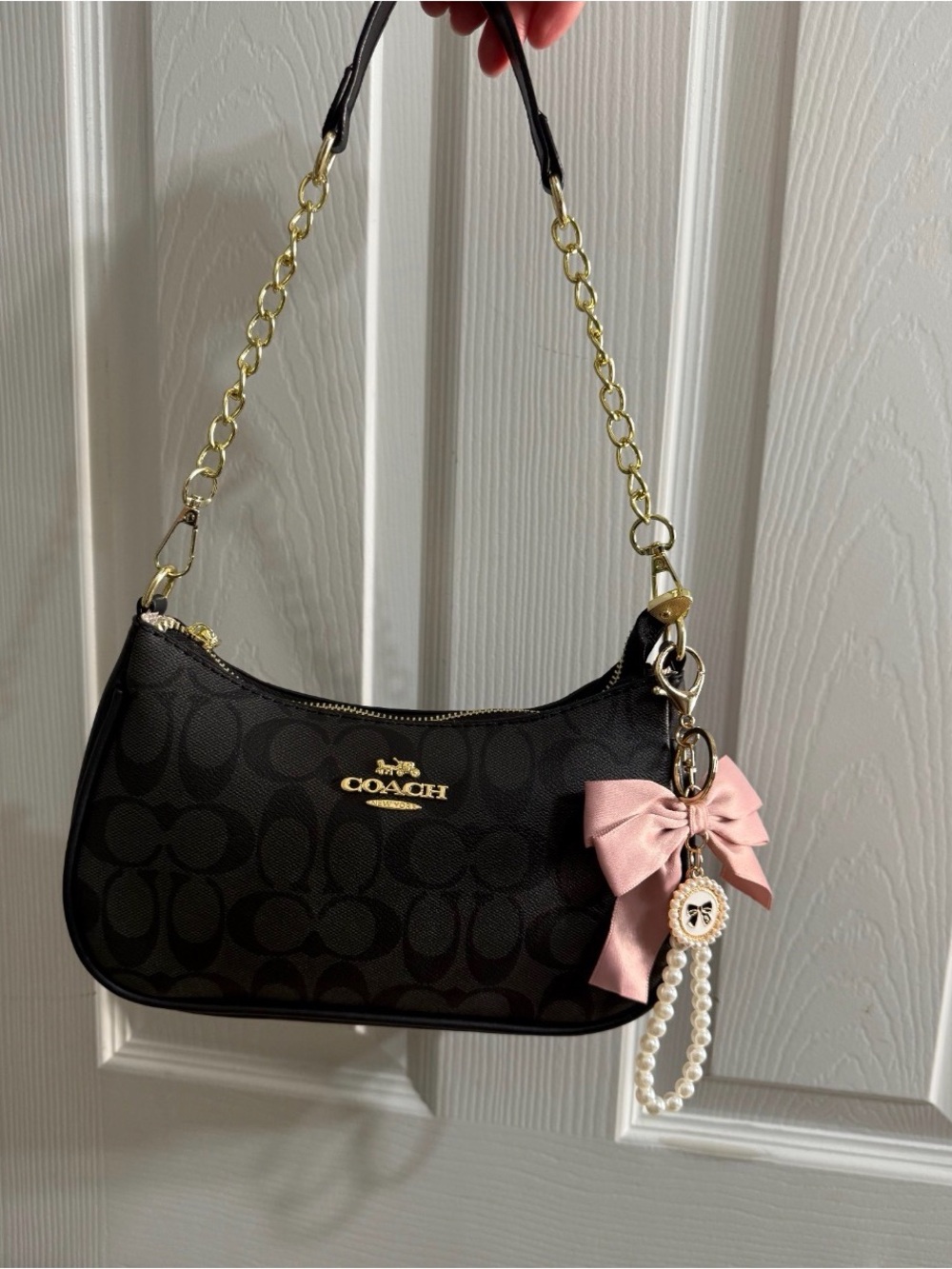 Coach Black Signature Mini Bag with Gold Hardware and Pink Bow Charm